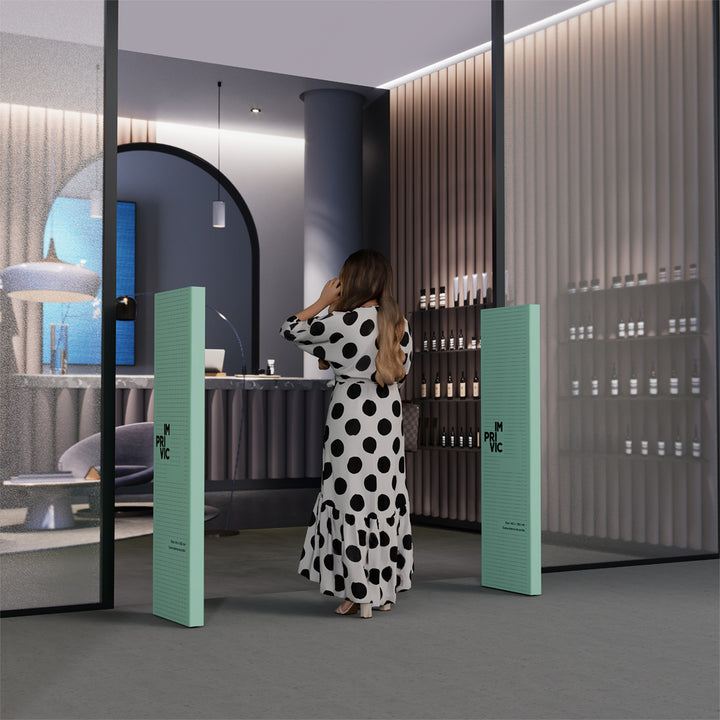 Cubrealarmas de cartón para entradas de tienda.